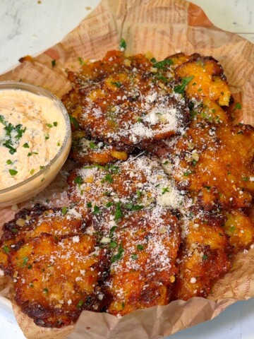Crispy Smashed Potatoes with Garlic-Chili Butter and Parmesan