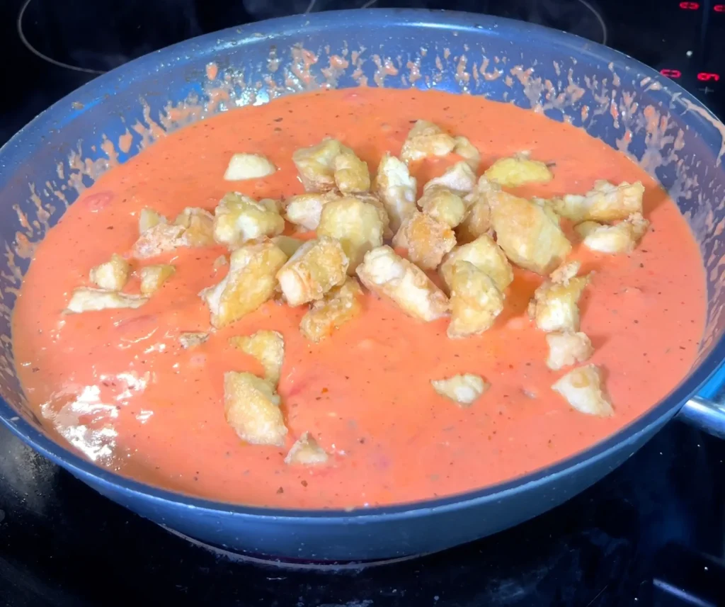 Crispy tofu chunks added to the creamy tomato sauce.