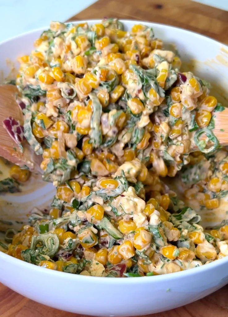 Final creamy corn salad prepared in a serving bowl