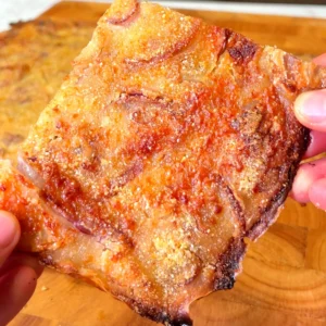 Close-up of crispy Italian Schiacciata bread with golden crust