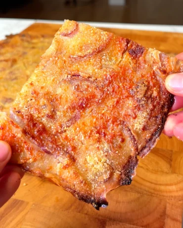 Close-up of crispy Italian Schiacciata bread with golden crust