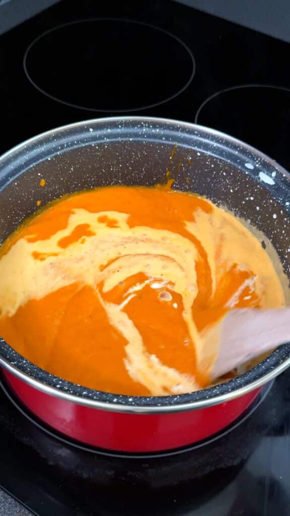 Stir in creamy coconut milk and simmer for a few minutes.


