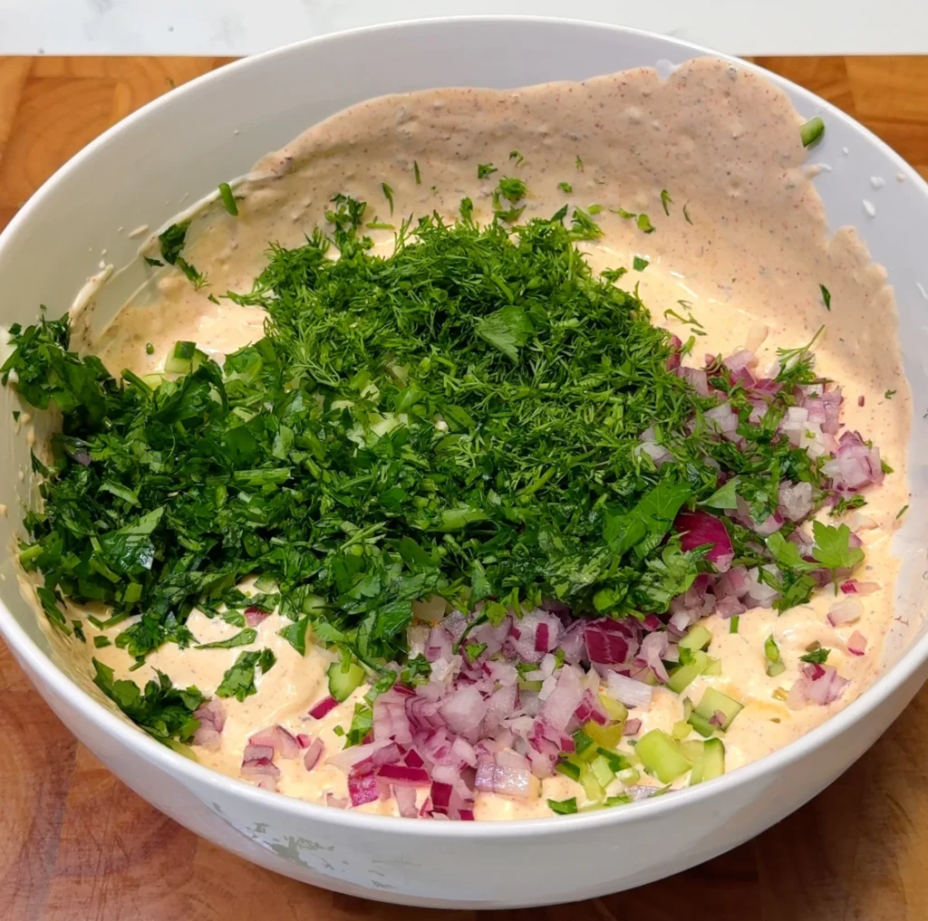 Adding Parsley and onions to dressing for air-fried potato curls