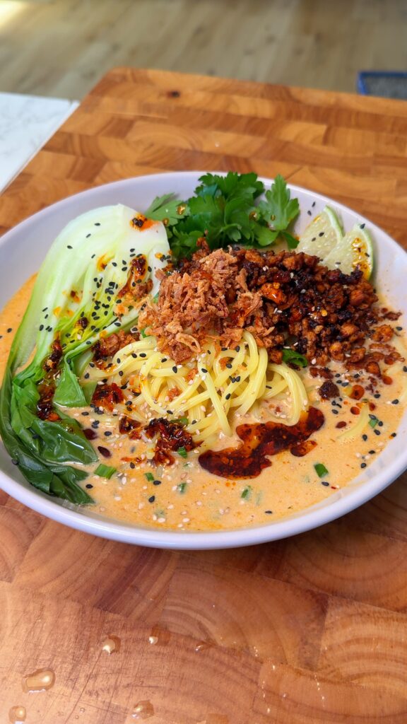 spicy thai noodle soup in a bowl