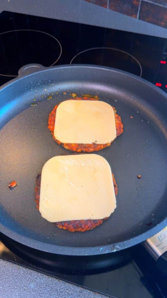 Cook the Patties – Pan fry until golden and crispy. Add vegan cheese if desired.