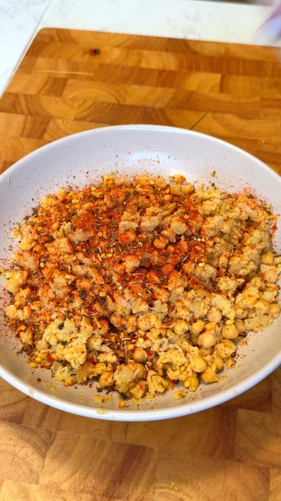 Mash your chickpeas until mostly creamy but still slightly chunky.