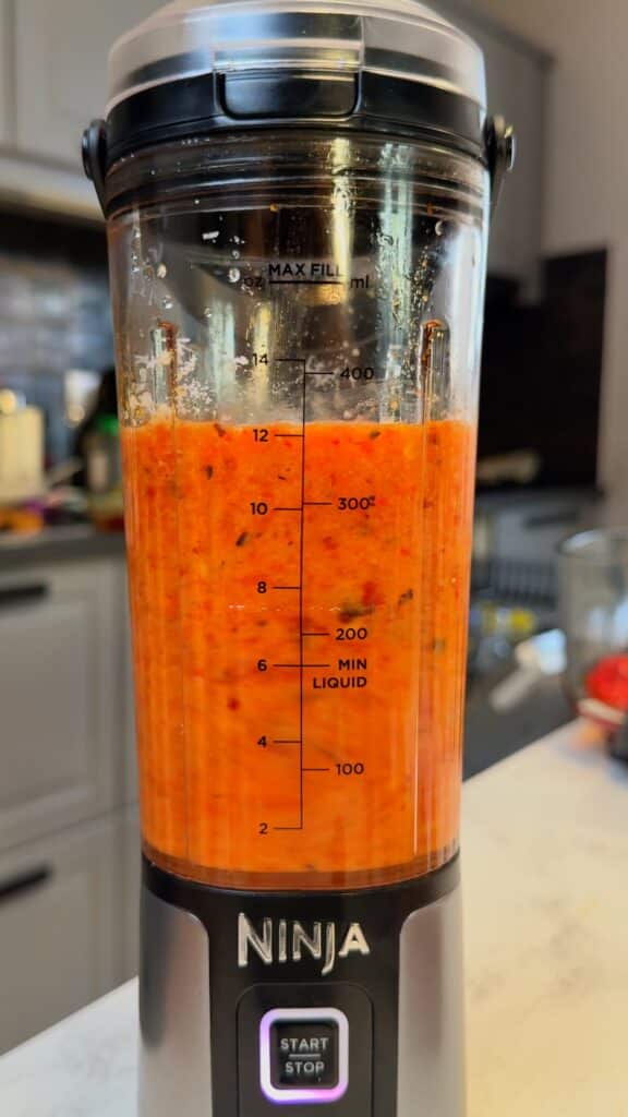 Blend the sauce: Combine roasted peppers, walnuts, lemon juice, vegan parmesan, salt, and pepper. Add water until smooth and creamy.