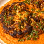 Cauliflower Steaks with Roasted Red Pepper Sauce and Chimichurri