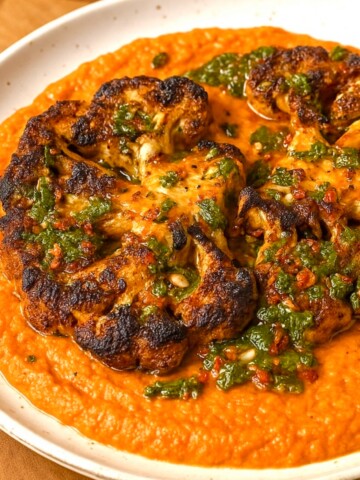 Cauliflower Steaks with Roasted Red Pepper Sauce and Chimichurri