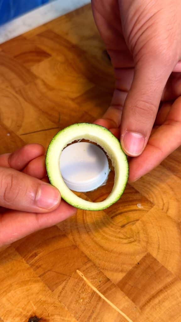 Cut the rings
 Slice zucchini into thick rounds. Use a corer or bottle cap to remove the centers, creating ring shapes. Save the centers for the dip.