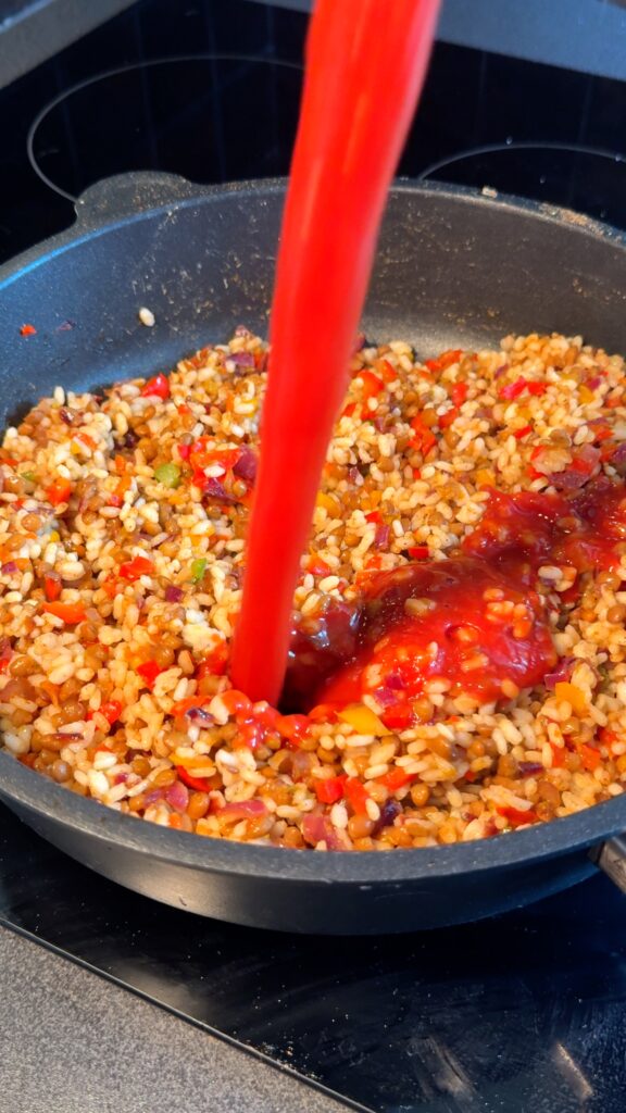 Make the Filling Sauté the onion and diced pepper tops in olive oil until tender. Add the rice, lentils, tomato sauce, and spices. Stir until the