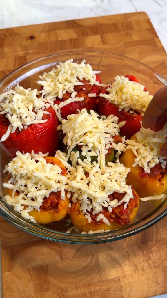 Stuff and Bake
Fill the pre-roasted peppers with the lentil mixture, top with vegan cheese, and bake until hot and bubbly.