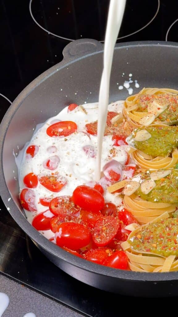 Pour in Liquids:
 Add oat cream and vegetable stock until the pasta is mostly covered.