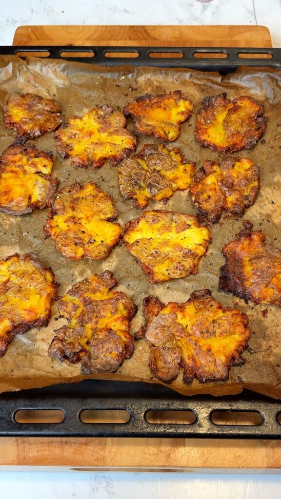 Boil, smash, and roast:
Boil potatoes in salted water until tender, drain, gently smash, drizzle with olive oil, season, and roast until golden and crisp.