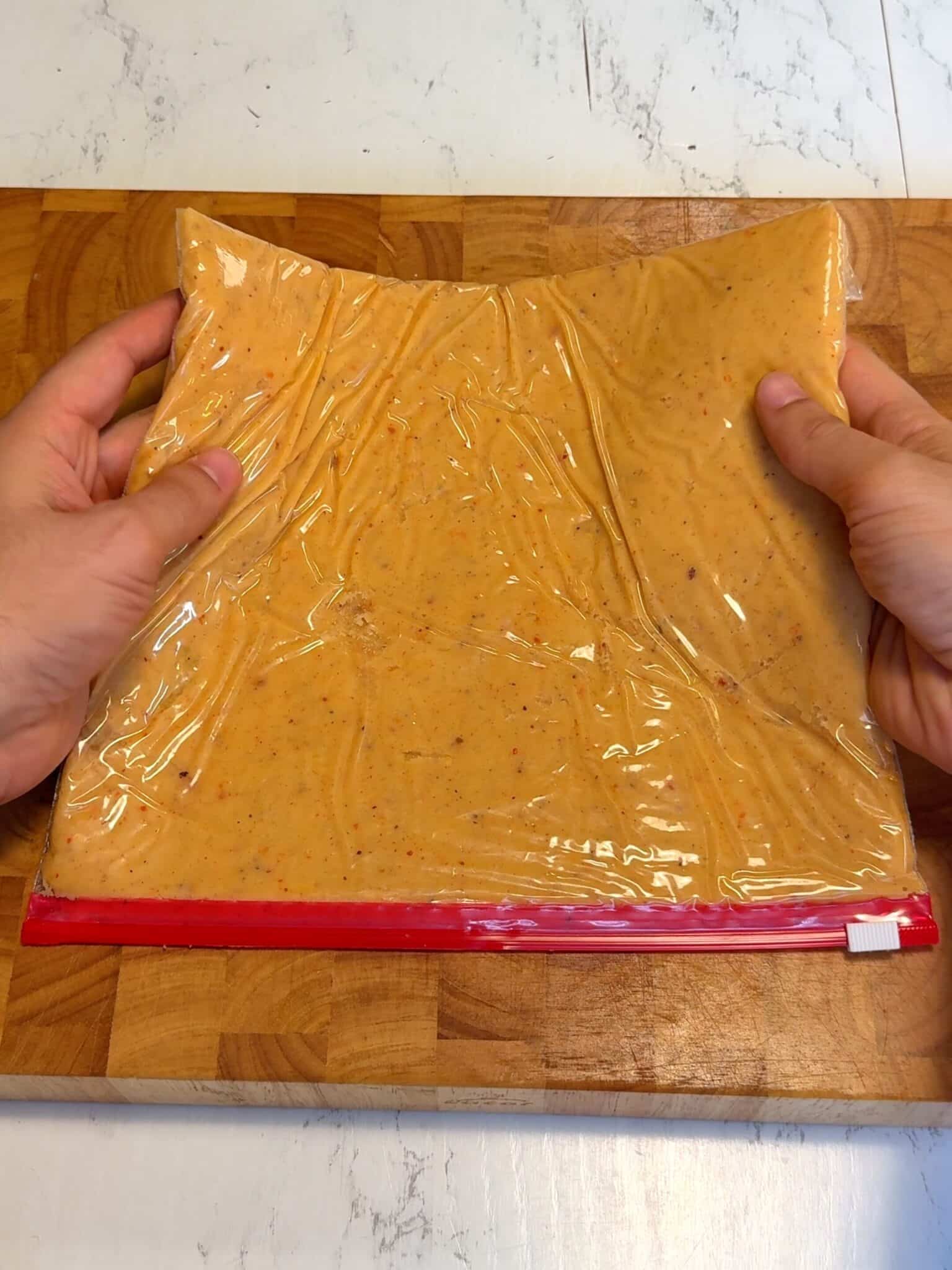 Potato dough flattened inside a ziplock bag and chilled before slicing