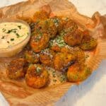 crispy vegan veggie balls with dip on parchment paper