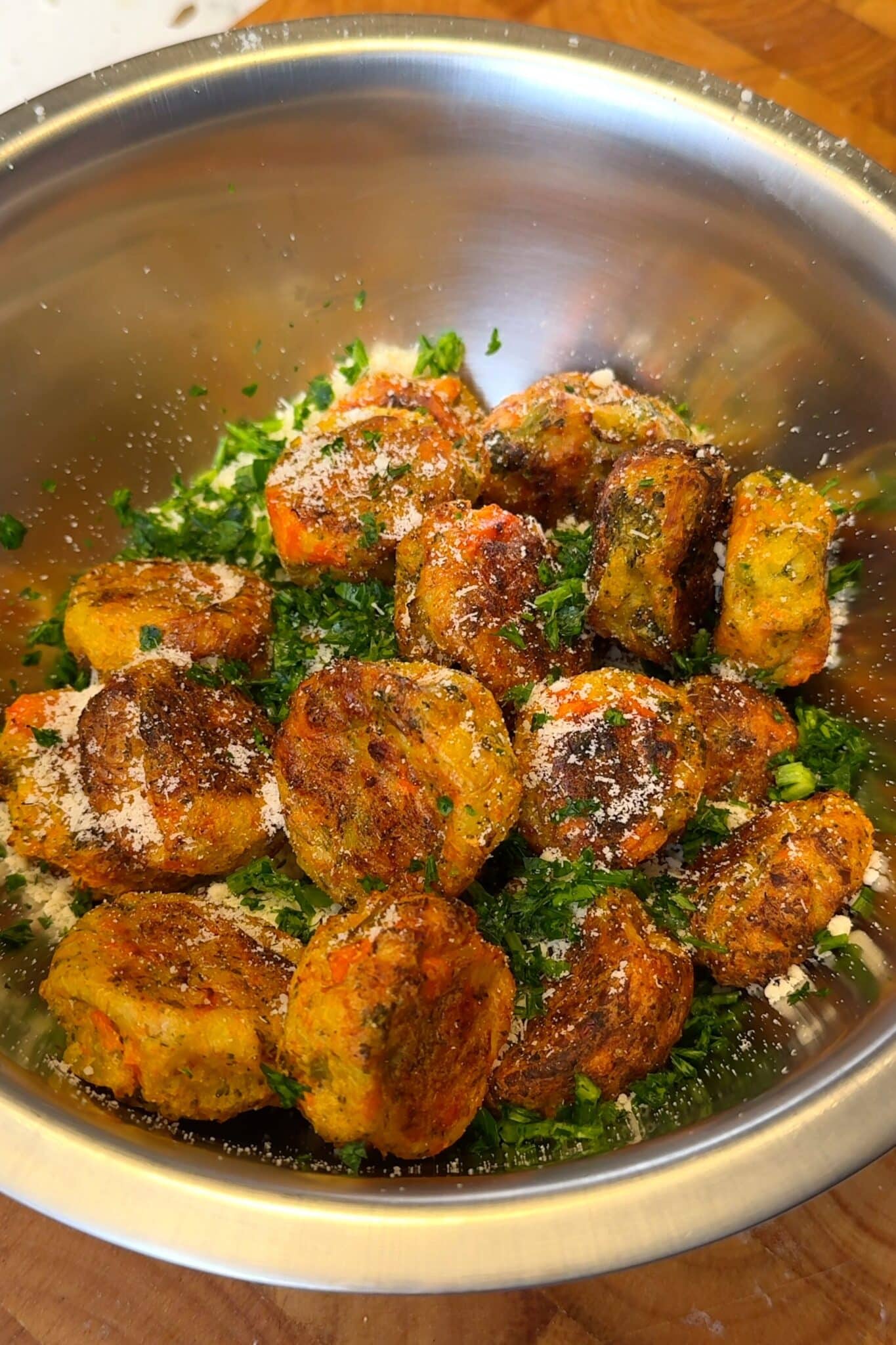 air fried veggie balls tossed with parsley and vegan parmesan
