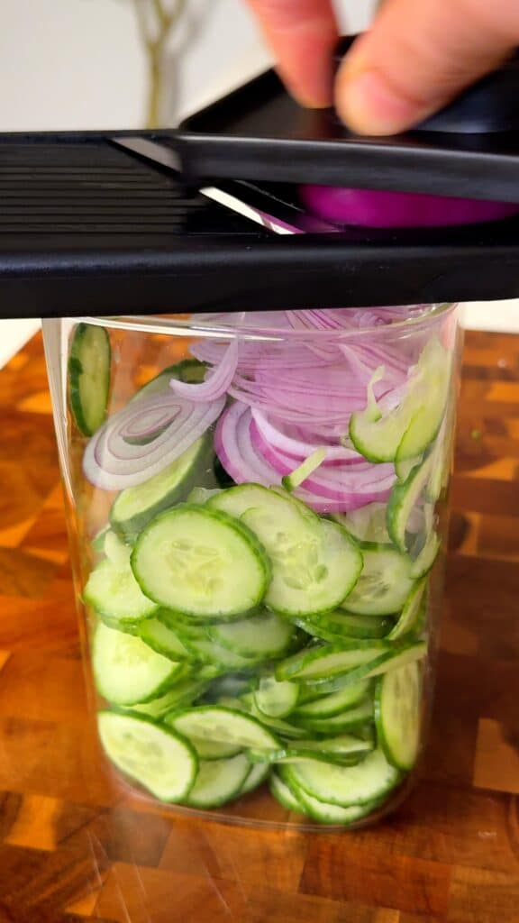 Slice the cucumber and onion very thin.