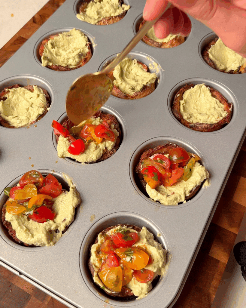 Assemble
Spoon the pesto cream cheese into each crispy cup and top with the cherry tomato bruschetta.