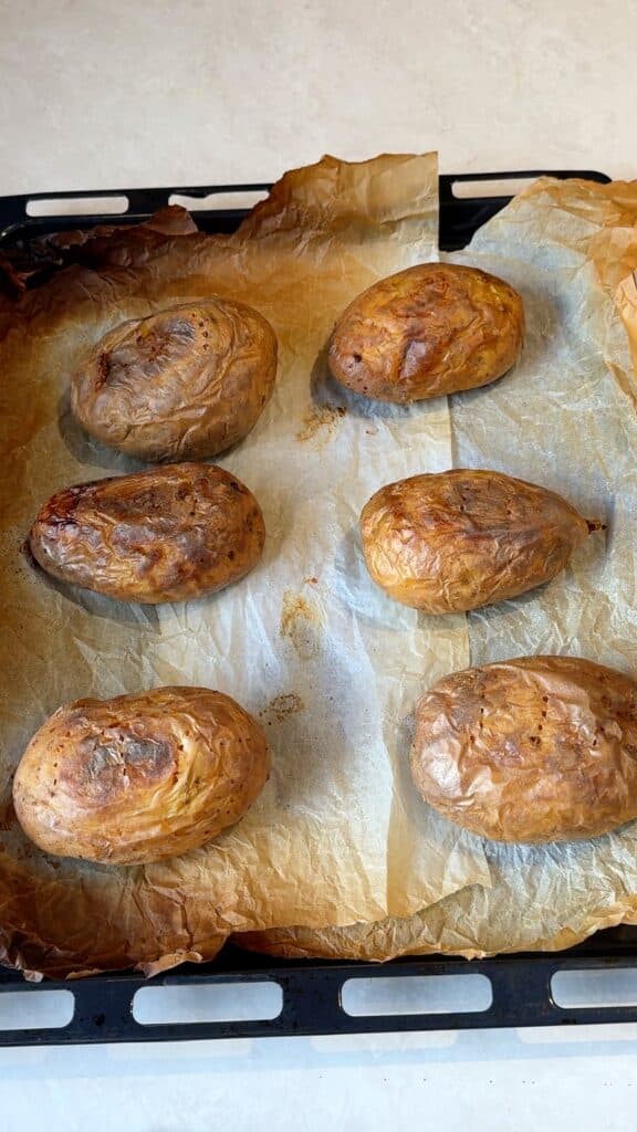 Bake the potatoesBake whole potatoes at 200°C / 400°F until completely tender, about 50 to 60 minutes. Let them cool until you can handle them.