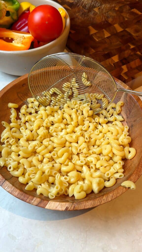 Cook the pasta
Boil until al dente, drain, rinse under cold water, and let it cool slightly.