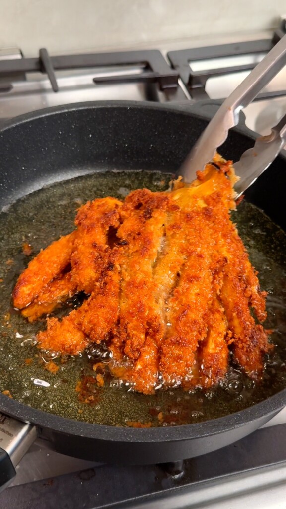 Fry until golden Fry in batches until deeply golden and shatteringly crispy. Drain on paper towels and serve hot with the spicy mayo.