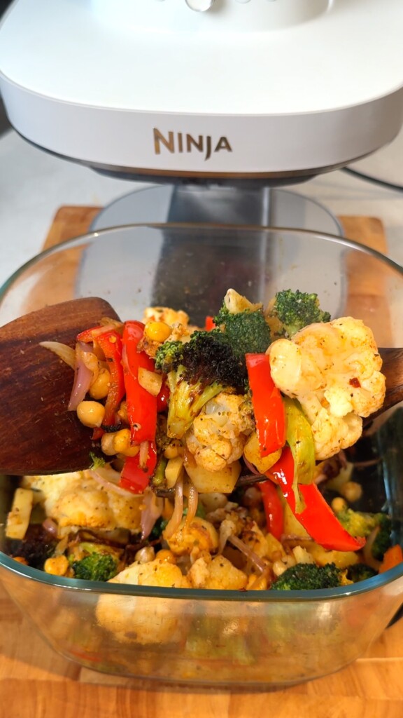 Crispy Mediterranean roasted vegetables and chickpeas in an air fryer basket