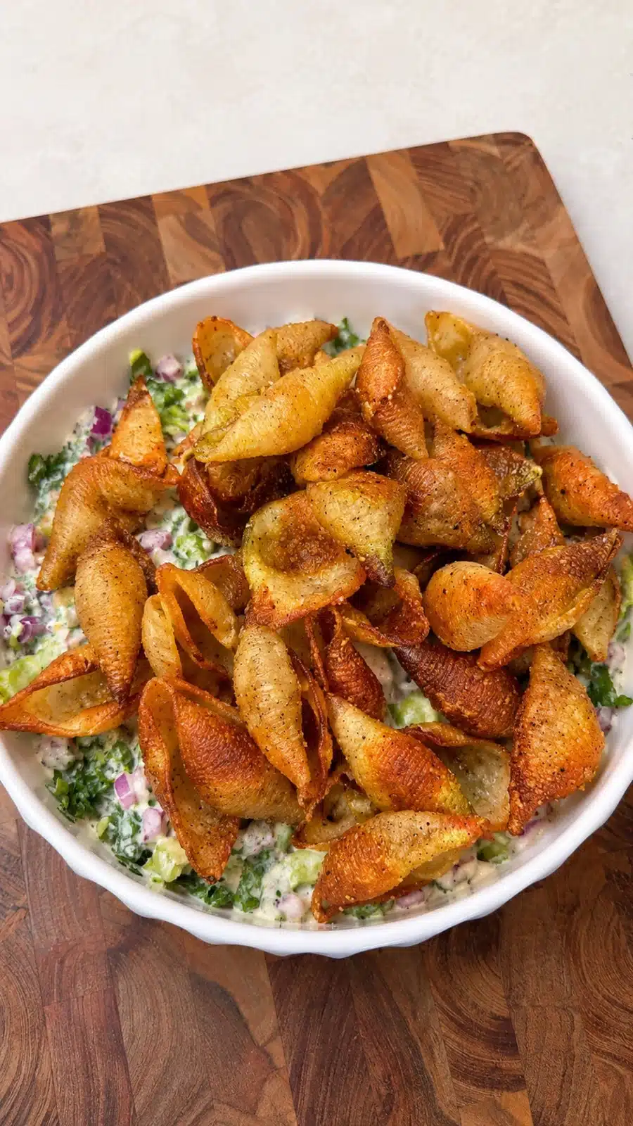 Crispy pasta salad topped with golden air fryer pasta chips