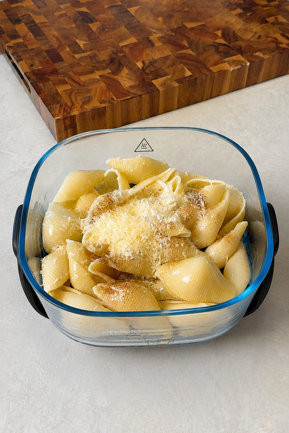 Pasta tossed with vegan parmesan before air frying