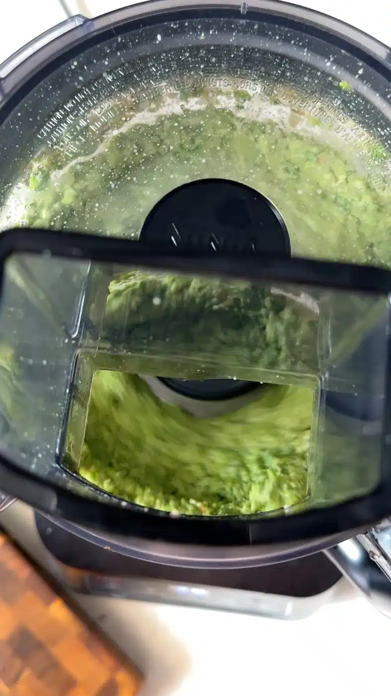 Pea pesto blending in a food processor until thick and creamy