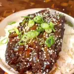 Eggplant unagi rice bowl glazed in sweet soy sauce with sesame and spring onion
