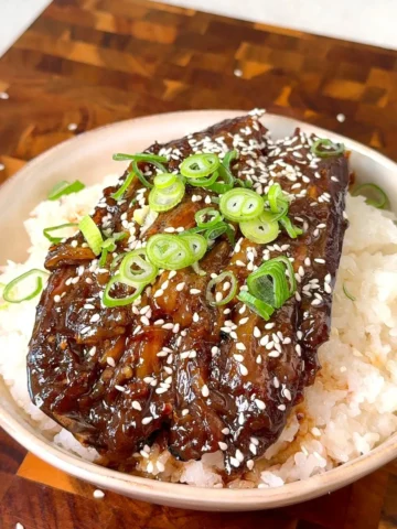 Eggplant unagi rice bowl glazed in sweet soy sauce with sesame and spring onion