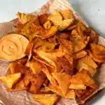 Crispy red lentil chips baked golden on a parchment lined tray