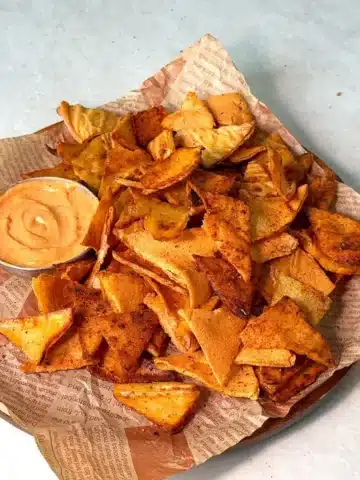 Crispy red lentil chips baked golden on a parchment lined tray