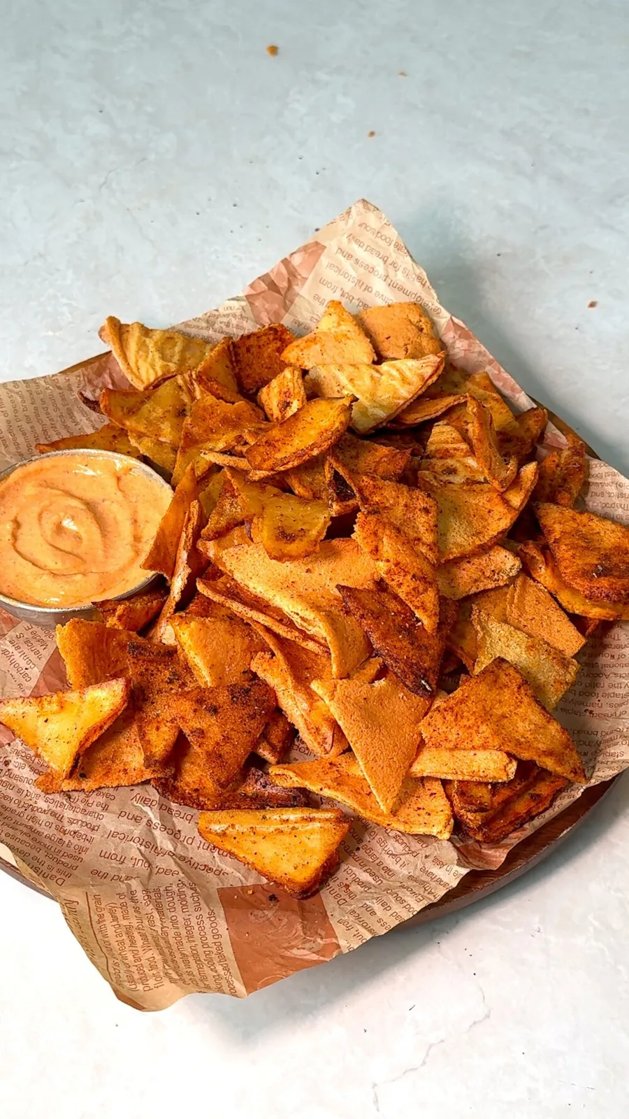 Crispy red lentil chips baked golden on a parchment lined tray