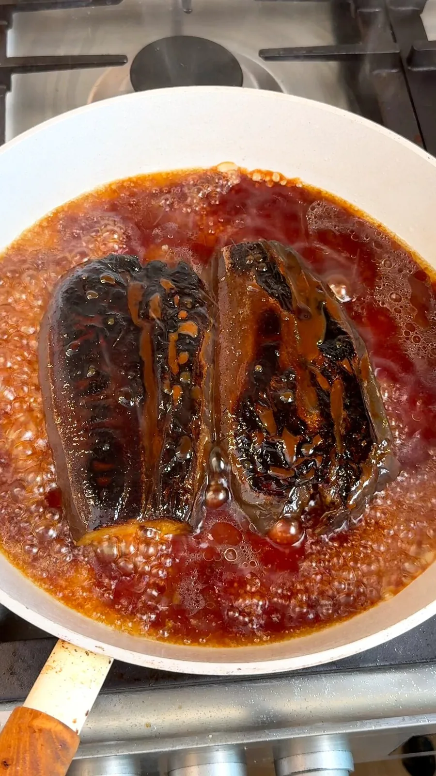 Eggplant glazing in bubbling sweet soy sauce