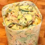 Creamy Asian cucumber salad with tofu and edamame in a glass jar