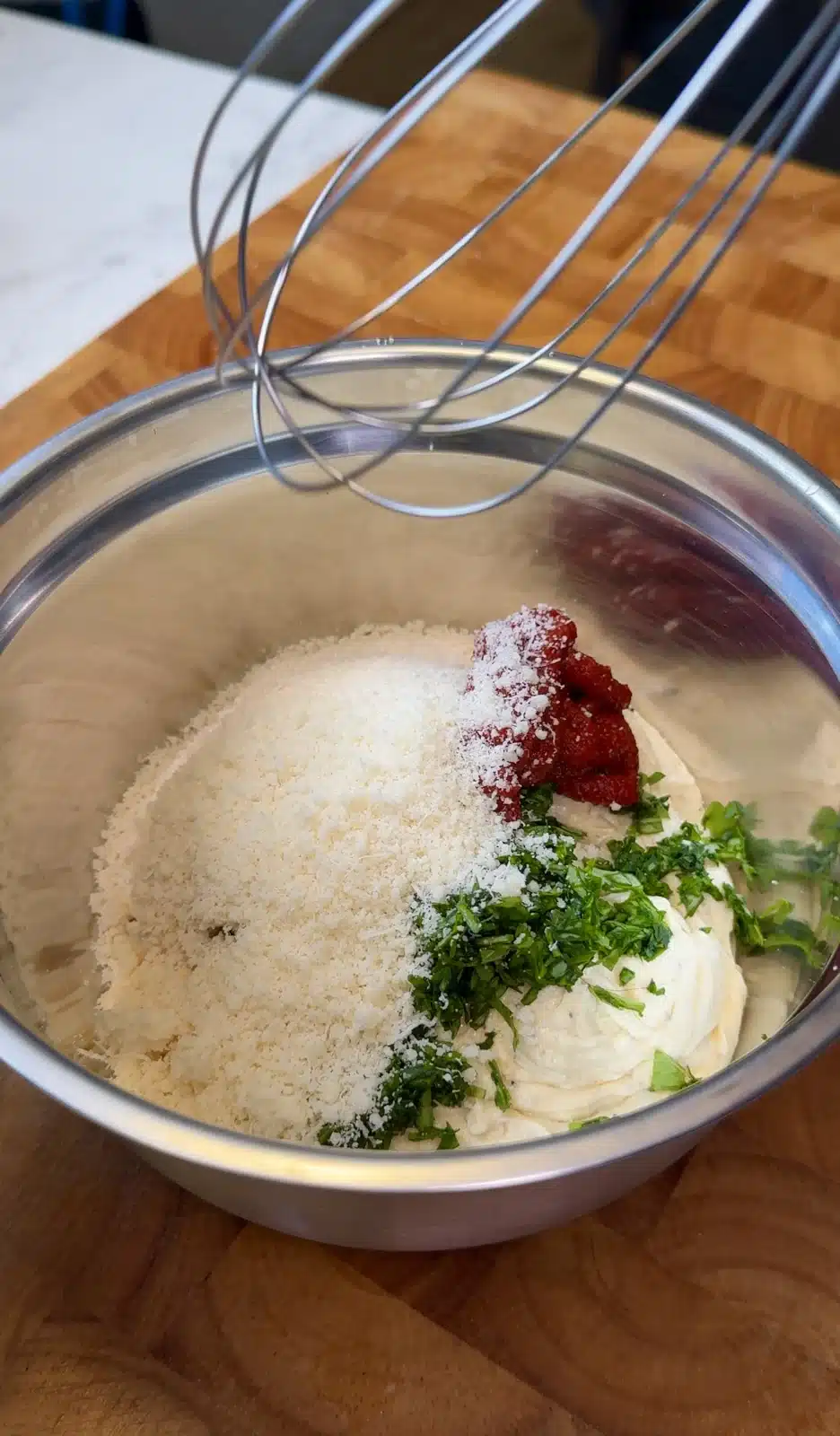 Tomato paste, vegan Parmesan and basil mixed into garlic butter