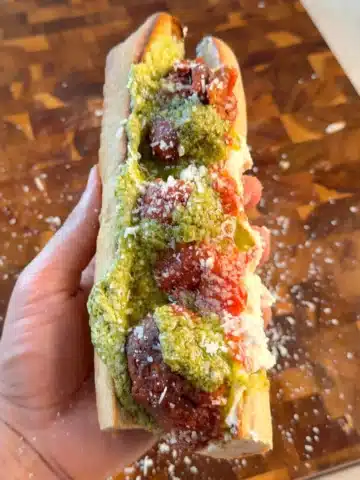 Lentil meatball sub with marinara, vegan ricotta and green pesto
