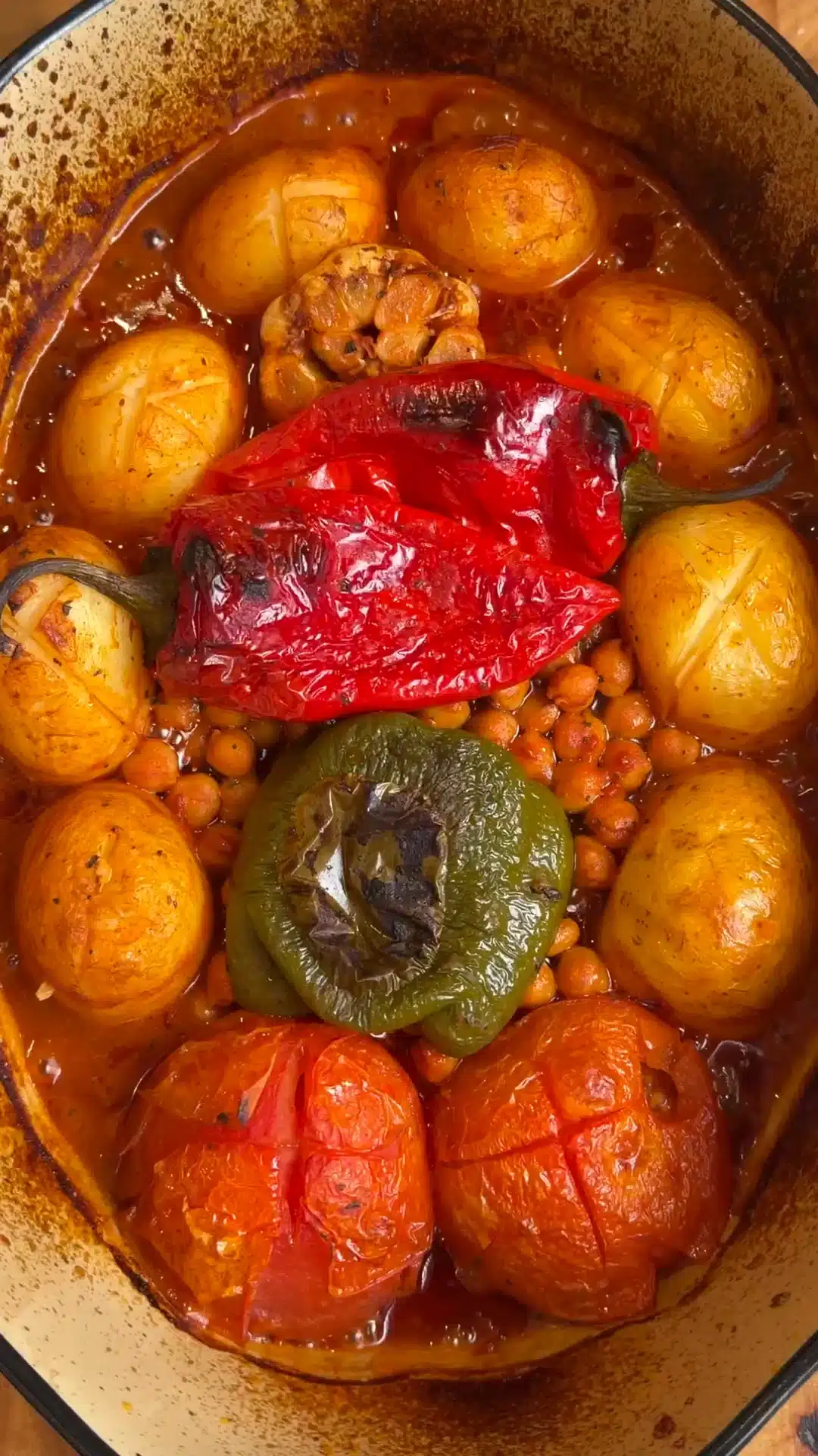 Roasted small potatoes, chickpeas, peppers, tomatoes and garlic in a tomato sauce.